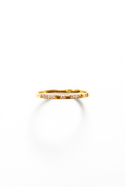 Thin and delicate ring with a small cubic zirconia gemstone a piece of jewelry that exudes elegance and sophistication. 