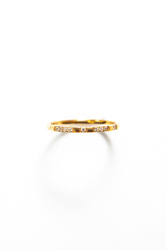 Thin and delicate ring with a small cubic zirconia gemstone a piece of jewelry that exudes elegance and sophistication. 