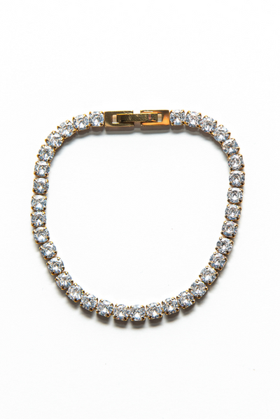 Our Jade Bracelet made with cubic zirconia bezel tennis bracelet, plated in lustrous 18k gold. 