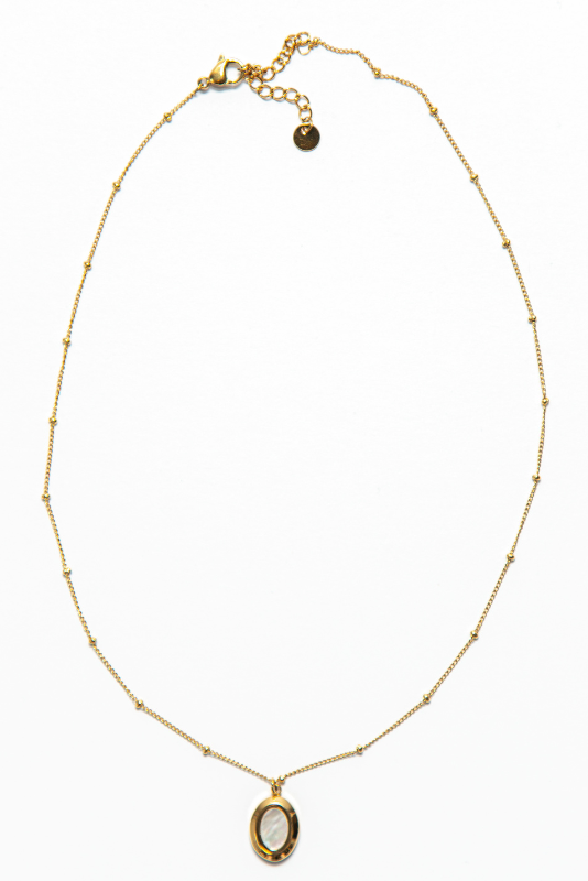 The Kate Necklace is adorned with an oval-shaped pendant that adds a pop of charm and personality to the piece. 