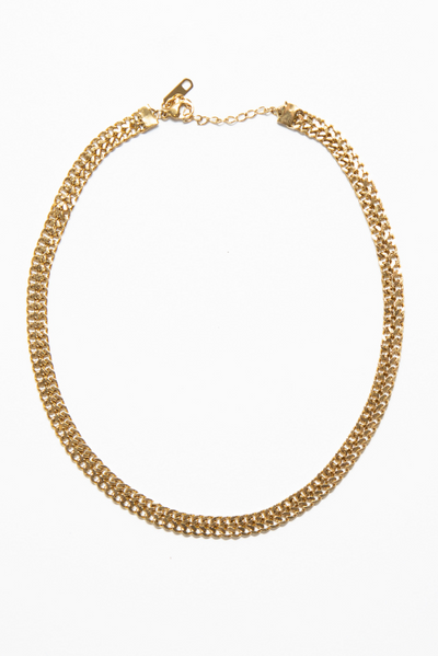 Spencer Choker is double curb chain choker is crafted from high-quality materials and features stunning gold plating that's sure to catch the eye.